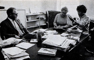 A black and white photograph showing Jabavu at The New Strand offices, alongside editor Kay and associate editor Connie George.