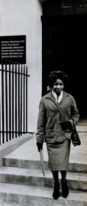 A black and white photograph showing Jabavu leaving The New Strand offices in London