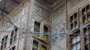 Alshanashil: An old Iraqi building feature. It is akin to a balcony which allowed people inside the house to see outside while allowing air to circulate inside. Photo taken in altorah neighborhood in Baghdad, 2017, by Mouayad Sary.