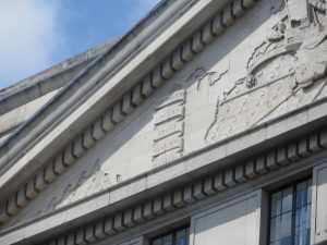 American names etched into rear facade: Washington, Lincoln, Grant, Hamilton, Franklin.