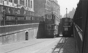 Two 33 trams passing one another at the entrance to Kingsway Tram Tunnel. 