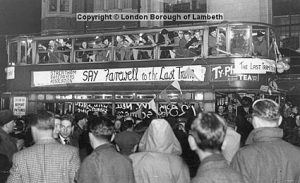 A crowd of Londoners saying their farewells to the last tram on the 33 route.